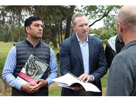 Minister Mick de Brenni with Member for Bundamba Lance McCullum releasing the Government's guidelines in a flood-impacted area of Goodna
