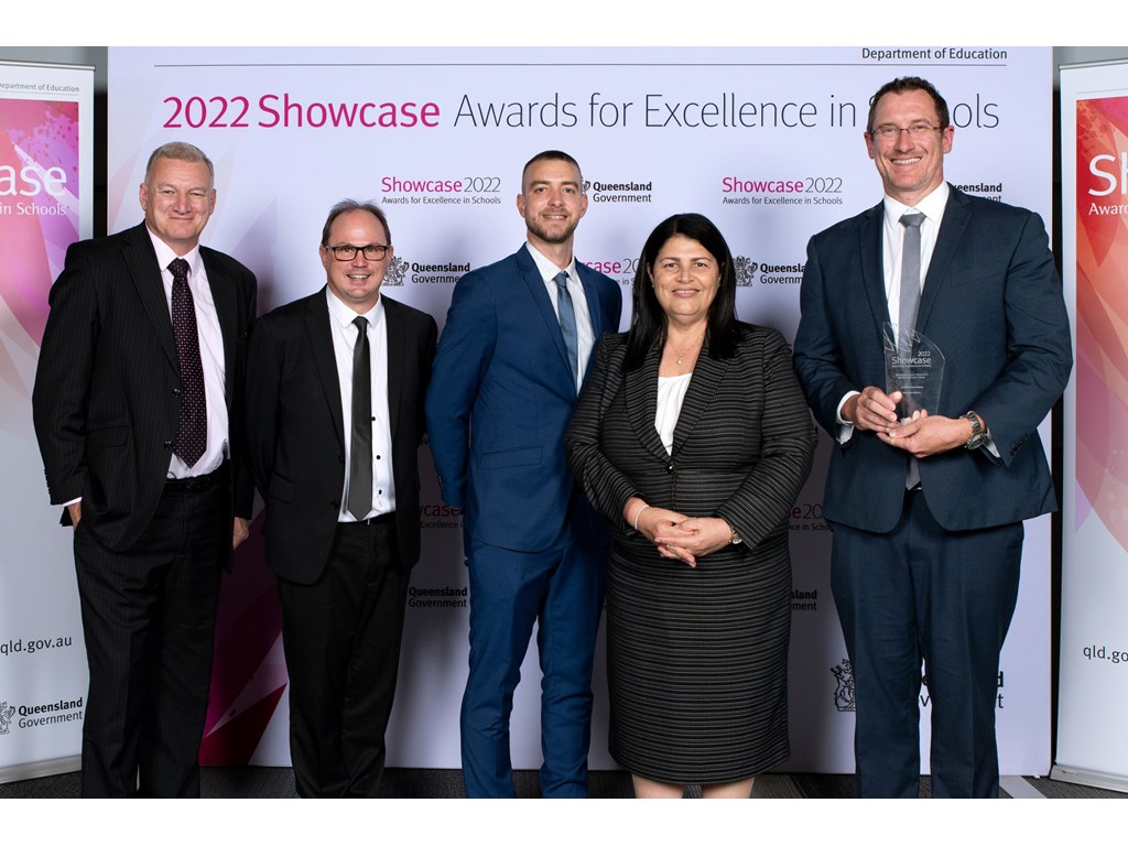 Education Minister Grace Grace with Director-General of the Department of Education Michael De'Ath (far left) and representatives from Lawnton State School, joint winners of the Bevan Brennan 'Every Child Needs a Champion' Award at the Showcase Awards for Excellence in Schools