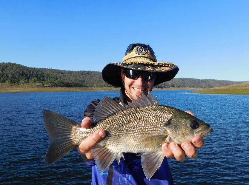 An Australian bass caught in one of the 63 impoundments in Queensland’s Stocked Impoundment Permit Scheme. Image – Please credit the Department of Agriculture and Fisheries.