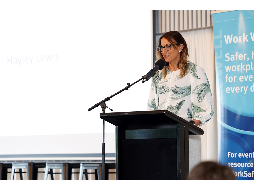 Hayley Lewis speaking at a World Mental Health Day breakfast after being named Queensland Mental Health Ambassador by Workplace Health and Safety Queensland (WHSQ).