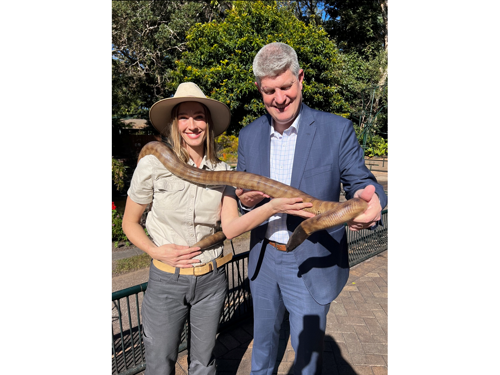 Tourism Minister Stirling Hinchliffe with Holly from the Gold Coast's Currumbin Wildlife Sanctuary and a park resident.