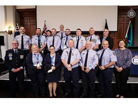 Minister Boyd with QCS recipients of the National Emergency Medal and Clasp