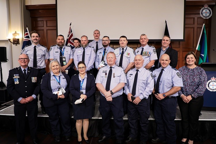 Minister Boyd with QCS recipients of the National Emergency Medal and Clasp