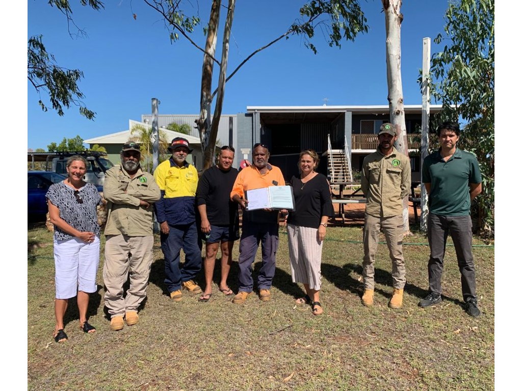 Kylie Eddie (Department of Resources), Paul Richardson, Lawrence George, Clayton Snow, Desmond Callopie, Leanne Edwards, Linton George, all from the RNTBC, and Mark Langford (Department of Resources) at the land handover ceremony.