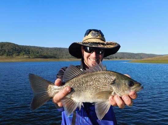 An Australian Bass caught at Cressbrook Dam, one of the 63 impoundments in Queensland’s Stocked Impoundment Permit Scheme. Photo: Department of Agriculture and Fisheries.   
