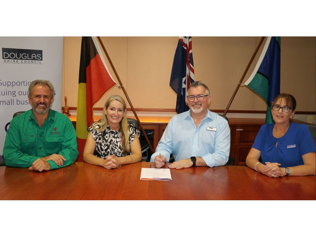 Douglas Chamber of Commerce's Jeremy Blockey, Small Business Commissioner Maree Adshead, Douglas Shire Mayor Michael Kerr and Douglas Shire Council Acting CEO Juanita Warner sign the Small Business Friendly Council charter.