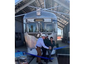 Assistant Tourism Minister Michael Healy and Outback Rail Adventures owners Sue and Alan Smith open $2.7 million in new workshop and siding facilities for two 'Silver Bullet' railmotors, RM2034 and RM2036.