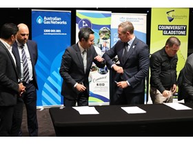 Energy Minister Mick de Brenni congratulates Sumitomo Corporation's Yoshikazu Ishikawa in Gladstone.