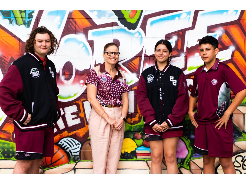 Woree State High School Principal Kathryn Todd with students Fletcher, Sienna, and Jaidyn