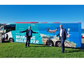 Tourism Minister Stirling Hinchliffe and Assistant Minister Michael Healy with one of 14 Queensland wrapped Greyhound Australia coaches at Bondi Beach.