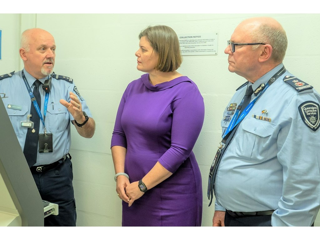 Corrective Services Minister Nikki Boyd and Commissioner Paul Stewart APM with the new contraband scanner at Brisbane Women's Correctional Centre. 